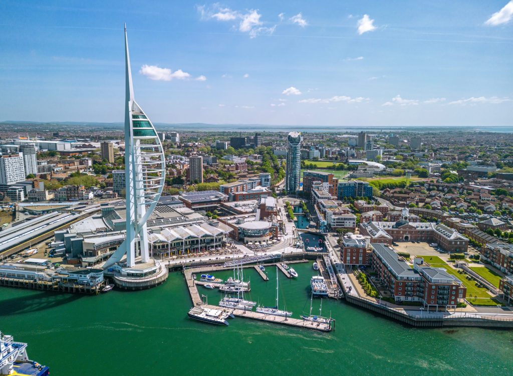 Acquisition of Coffin Mew expands Knights South East presence - A view of a city with boats docked in the water.