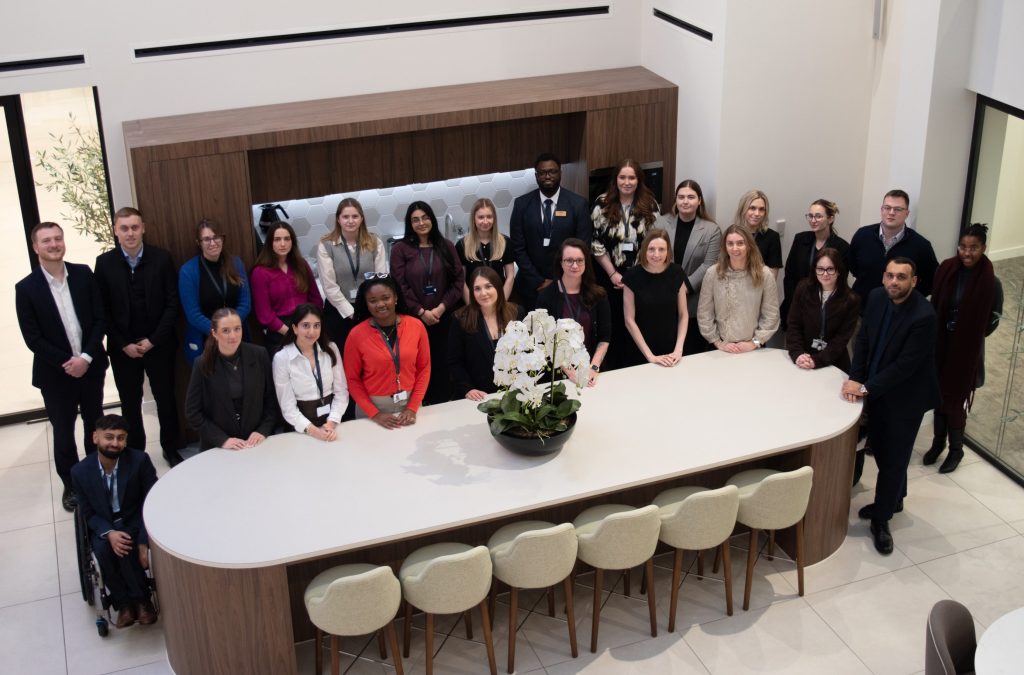 Thirty-one trainees begin training contracts at Knights - A group of people posing for a picture in a conference room.