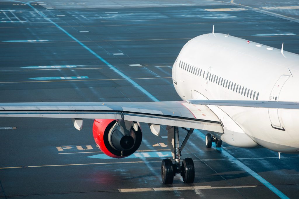 Knights Legal Services - A large passenger jet sitting on top of an airport tarmac.