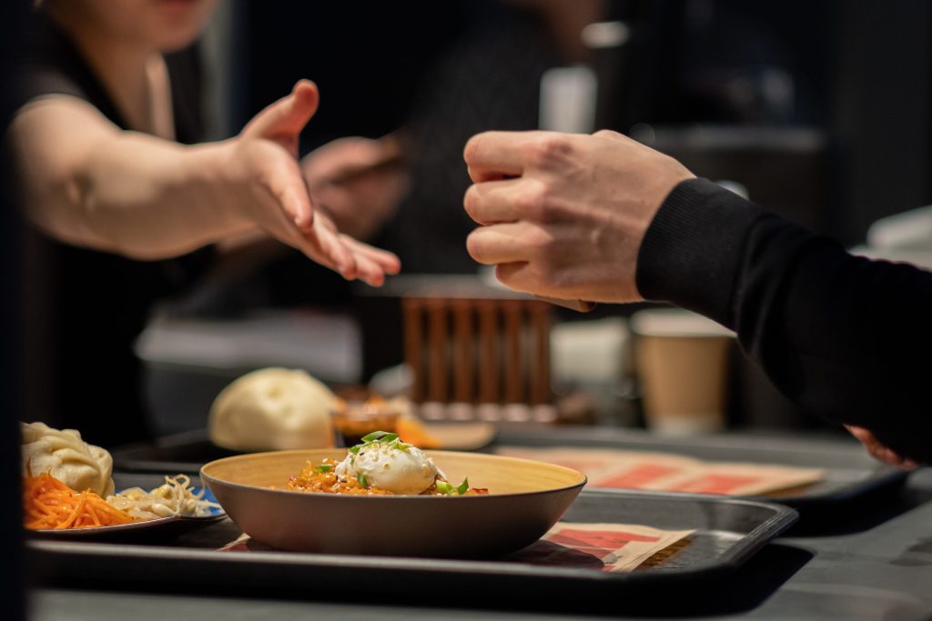 Knights Legal Services - A group of people sitting at a table with plates of food.