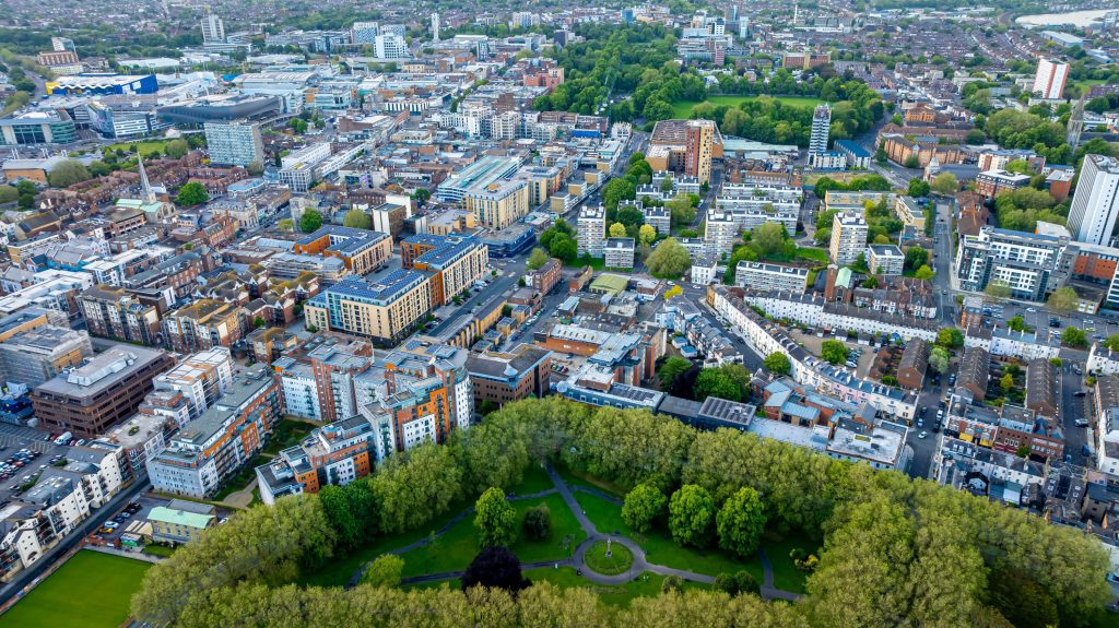 Knights expands South East presence with acquisition of Moore Barlow's commercial and private wealth business - A view of a city with lots of tall buildings.
